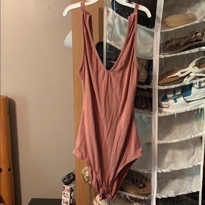 nude colored body suit